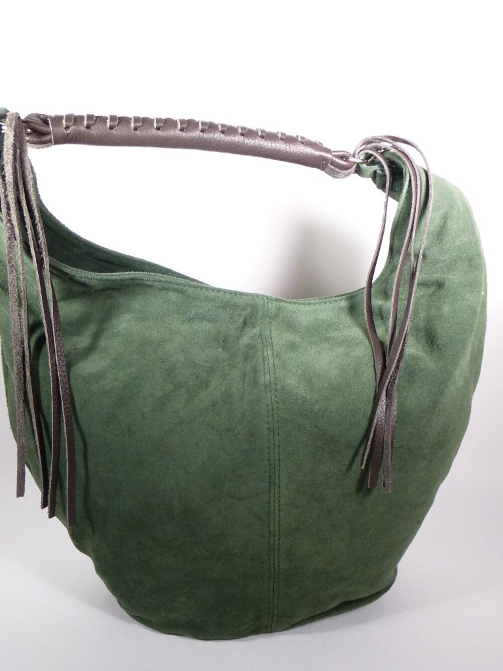 New green suede bucket bag with brown Italian leather handle and tassels